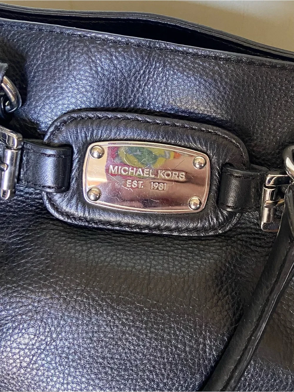 Michael Kors Black Pebbled Leather Satchel with Silver-Tone Plaque